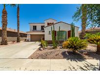 Charming two-story home boasts desert landscaping, red shutters, and a welcoming front entrance at 861 E Indian Wells Pl, Chandler, AZ 85249