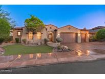 Charming single-story home featuring a tile roof, landscaped front yard, and a two-car garage, set against a twilight sky at 12809 W Oyer Ln, Peoria, AZ 85383