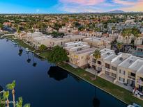 Stunning aerial view of waterfront condos showcasing beautiful architecture and water access at 1414 W Coral Reef Dr, Gilbert, AZ 85233
