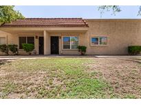 Beige, single-story home with red tile roof and desert landscaping in a sunny setting at 17228 N 16Th Dr # 3, Phoenix, AZ 85023