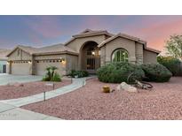 Inviting single-story home with a terracotta roof, arched entry, and low-maintenance desert landscaping at 2058 E Marlene Dr, Gilbert, AZ 85296