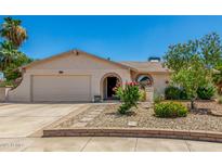 Charming single-story home features a landscaped front yard and inviting arched entryway at 2312 W Temple St, Chandler, AZ 85224