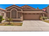 Charming single-story home featuring a two-car garage, desert landscaping and a timeless, neutral color palette at 3440 E Southern Ave # 1088, Mesa, AZ 85204