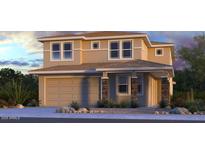 Two-story home featuring a two-car garage, and meticulously landscaped front yard at 10921 E Texas Ave, Mesa, AZ 85212