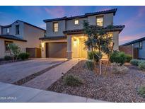 Charming two-story home with a well-manicured front yard and a welcoming entrance at 12122 W Levi Dr, Avondale, AZ 85323