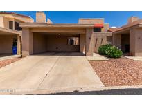 Charming townhouse with a covered carport and easy to maintain desert landscaping at 26 E Coral Gables Dr, Phoenix, AZ 85022