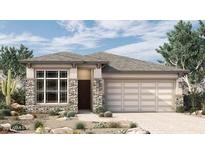 Charming single-Gathering home featuring a stone facade and a two-car garage in a landscaped yard at 26031 S 228Th Pl, Queen Creek, AZ 85142