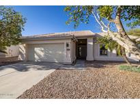 Charming single-story home featuring a well-maintained front yard and attached two-car garage at 3956 N 151St Dr, Goodyear, AZ 85395