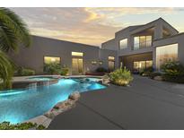 Inviting backyard pool with a hot tub and lush landscaping, ideal for relaxation and entertaining at 28729 N 107Th St, Scottsdale, AZ 85262