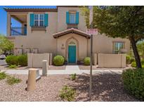 Charming two-story home with blue door and shutters nestled in a well-maintained community at 4705 E Red Oak Ln # 101, Gilbert, AZ 85297