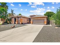 Charming single-story home with a spacious driveway and desert landscaping at 776 W Carob Way, Chandler, AZ 85248