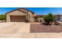Charming single-story home featuring a well-manicured front yard and a two-car garage at 1066 Leisure World --, Mesa, AZ 85206