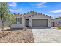 Beautiful single-story home with low maintenance desert landscaping, charming architectural details, and a spacious two-car garage at 1960 N Loretta Pl, Casa Grande, AZ 85122