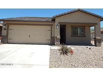 Charming single-Gathering home with a two-car garage and low maintenance desert landscaping at 25744 W Winston Dr, Buckeye, AZ 85326