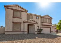 Inviting two-story home featuring neutral stucco and a two-car garage at 31700 N Sunflower Way, San Tan Valley, AZ 85143