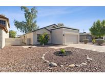 Charming single-story home featuring a well-kept yard with decorative rock and an attached two-car garage at 3955 W Cindy St, Chandler, AZ 85226