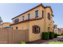 Charming two-story home with a desert landscape, a stucco exterior and a terracotta tiled roof at 4682 E Redfield Rd, Gilbert, AZ 85234