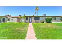 Inviting front yard with a brick path leading to the entrance of the residence at 6721 E Mcdowell Rd # B309, Scottsdale, AZ 85257