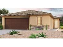 Charming single-story home with a tile roof, desert landscaping and an attached two-car garage at 7956 S Namaka Dr, Casa Grande, AZ 85193