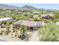 Stunning home with solar panels and desert landscaping in a mountain community at 9421 E Calle De Valle Dr, Scottsdale, AZ 85255