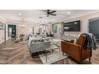 Open-concept living and dining area showcases modern finishes, stylish lighting, and an inviting atmosphere at 1522 W Willetta St, Phoenix, AZ 85007