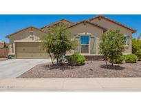 Charming single-Gathering home featuring a 2-car garage and well-maintained desert landscaping at 18474 W College Dr, Goodyear, AZ 85395
