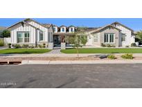 Beautiful single-story home features a manicured lawn, sidewalk, and neutral color palette at 19910 E Vallejo St, Queen Creek, AZ 85142