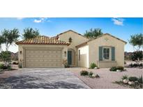 Inviting single-story home with a two-car garage, desert landscaping, and a classic tile roof at 20113 W Campbell Ave, Buckeye, AZ 85396