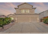 Stunning two-story home with a three-car garage, desert landscaping, and sunset views at 20809 N 17Th St, Phoenix, AZ 85024