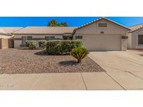 Charming single-story home with a well-maintained gravel yard and a two-car garage at 3343 W Lone Cacuts Dr, Phoenix, AZ 85027