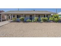 Charming single-story home featuring a gravel front yard and a covered entryway at 3347 W Roma Ave, Phoenix, AZ 85017