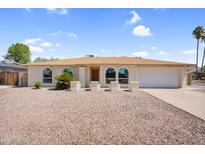 Charming single-story home with a well-maintained yard and beautiful desert landscaping at 3514 W Helena Dr, Glendale, AZ 85308