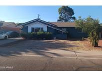 Cozy single-story home featuring desert landscaping and a classic-style roof at 3830 W Cavalier Dr, Phoenix, AZ 85019