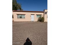 Charming single-story home with a well-maintained yard and a desert landscape at 4625 W Thomas Rd # 48, Phoenix, AZ 85031