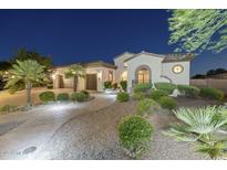 Elegant home featuring stucco exterior, well-manicured landscaping, and a paver walkway leading to the front entrance at 5243 E Windstone Trl, Cave Creek, AZ 85331