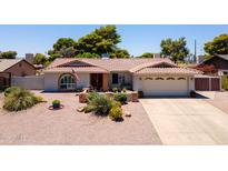 Charming single-story home with desert landscaping, a two-car garage, and a welcoming front entrance at 7318 S Mcallister Ave, Tempe, AZ 85283