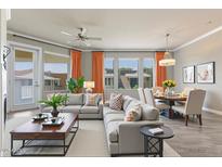 Bright, open living room with modern furniture and large windows, creating an inviting and spacious atmosphere at 7601 E Indian Bend Rd # 3002, Scottsdale, AZ 85250