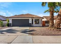 Charming single-story home with a well-maintained front yard and attached two-car garage at 1736 E Bluefield Ave, Phoenix, AZ 85022