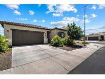 Charming single-story home featuring a two-car garage, desert landscaping, and a welcoming facade at 2753 E Fossil Ridge Rd, Phoenix, AZ 85050