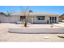 Charming single-story home featuring a well-maintained front yard and an attached garage at 3203 W Libby St, Phoenix, AZ 85053