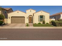 Charming single-story home featuring a tile roof, desert landscaping, and a two-car garage at 5258 S Verde --, Mesa, AZ 85212