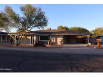 Charming single-story home with desert landscaping, covered parking, and updated exterior paint at 6702 E Almeria Rd, Scottsdale, AZ 85257