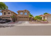 Charming two-story home with desert landscaping, and a two car garage at 7724 W Oraibi Dr, Glendale, AZ 85308