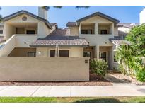 Charming two-story townhouse with a tile roof, private balcony, and beautifully landscaped surroundings at 1222 W Baseline Rd # 119, Tempe, AZ 85283