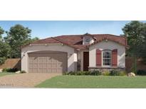Charming single-story home with a two-car garage and well-manicured lawn at 1482 W Ridge Rd, Apache Junction, AZ 85120