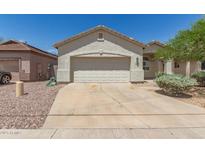 Charming single-story home with a neutral color palette, desert landscaping, and a two-car garage at 15034 N 30Th St, Phoenix, AZ 85032