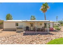 Cozy home featuring a charming covered patio and beautiful landscaping at 17200 W Bell Rd # 2189, Surprise, AZ 85374