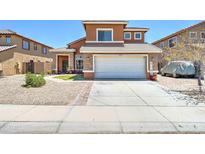 Charming two-story home with a stone-accented facade and a well-maintained front yard at 25519 W Crown King Rd, Buckeye, AZ 85326