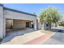 Beautiful home exterior with carport, desert landscaping and sidewalk access at 3415 N 36Th St # 3, Phoenix, AZ 85018