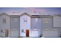 Modern townhome featuring a private garage and inviting front entrance at 7454 S 75Th Dr, Laveen, AZ 85339